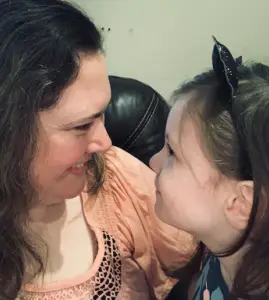 Daughter and mother looking lovingly at one another